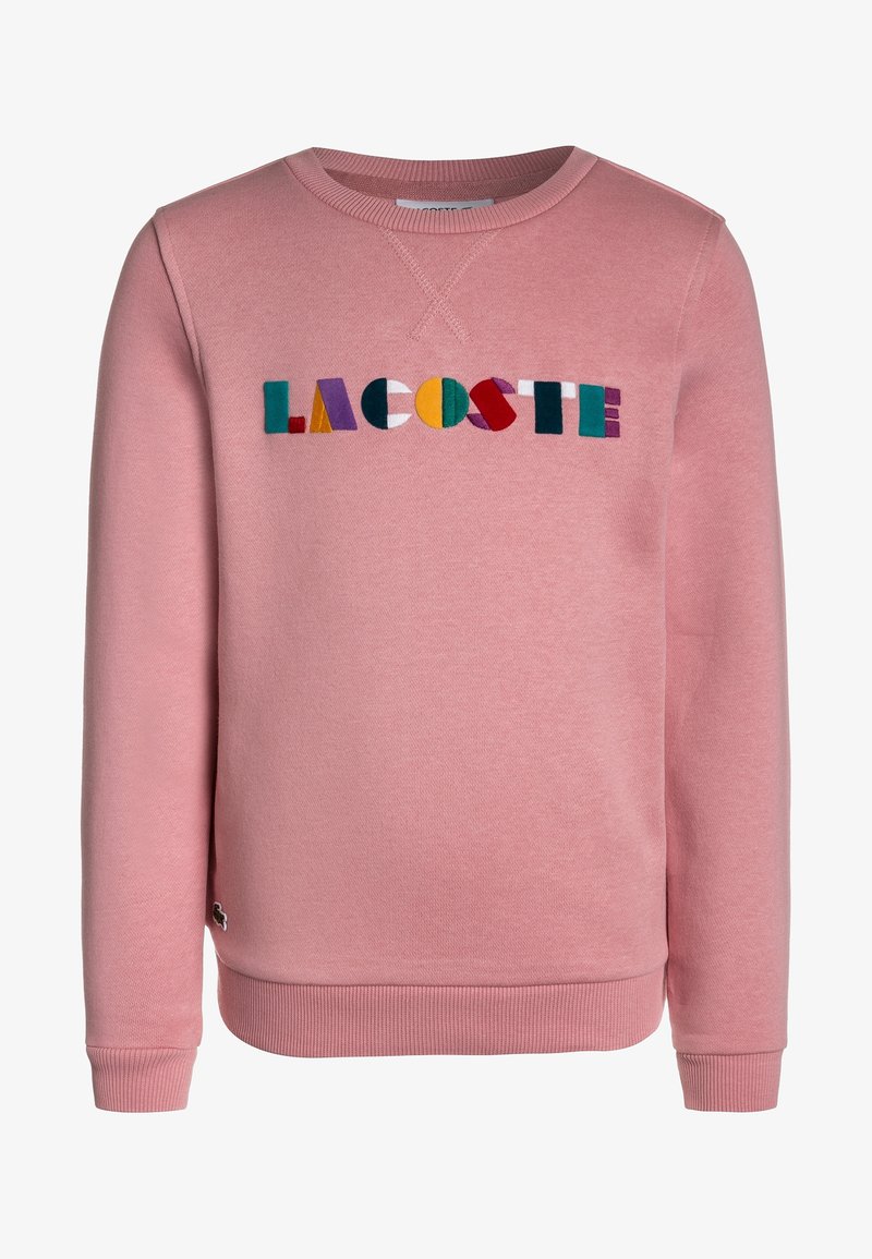 Sweat-shirt rose avec poignets et ourlet côtelés, arborant le logo "LACOSTE" multicolore brodé sur le devant. Confectionné en matière douce.