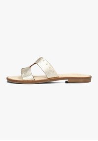 Gold leather slide sandals featuring two wide straps with stud accents, a flat wooden sole, and a smooth footbed.