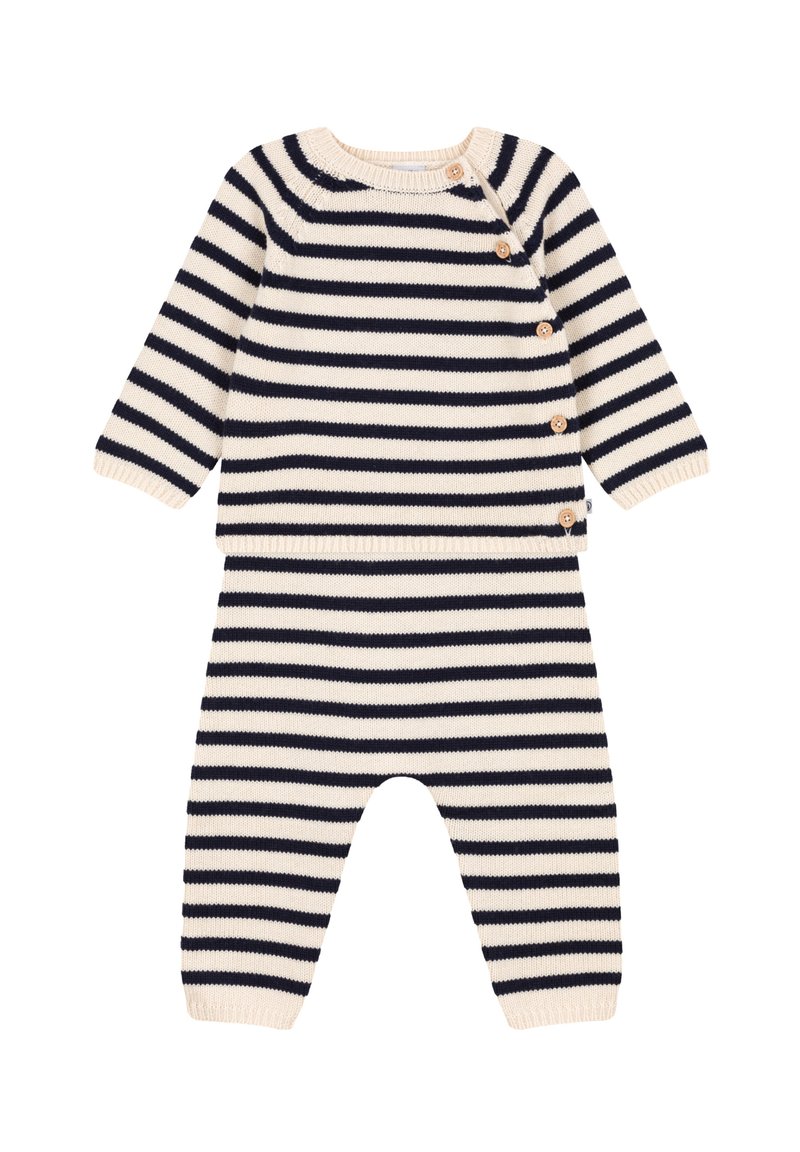 Completo a righe in maglia con colori crema e blu navy, scollatura rotonda, maniche lunghe e dettagli con bottoni in legno lungo la spalla.