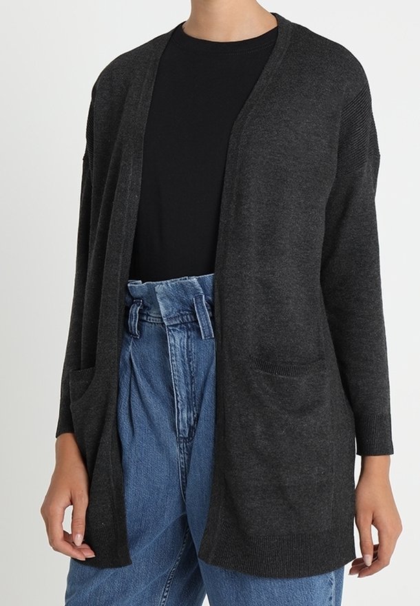 Dark gray knit cardigan with open front, long sleeves, and two front pockets. Worn over a black shirt and high-waisted light blue jeans.