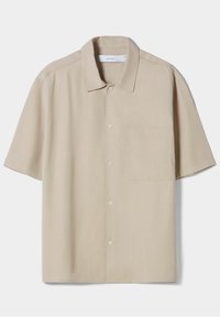 Short-sleeve beige shirt made of smooth fabric, featuring a pointed collar, front button closure, and a chest pocket.