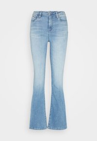 Ljusblå utsvängda jeans i denim, med hög midja, dragkedja och en tvättat look. Sömmen är något slitna.