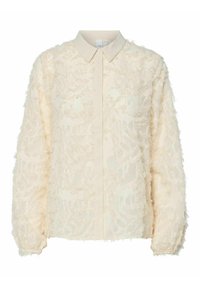 Vaaleanbeige paita, jossa on teksturoitu ja repaleinen kangas, jossa on kukkakuosi. Paidassa on napillinen kaulus ja pitkät hihat.