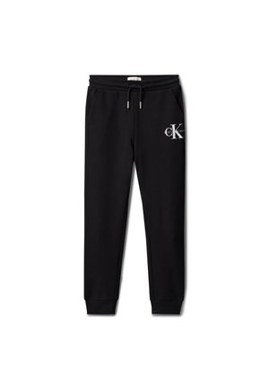 Pantaloni jogger neri Calvin Klein con fascia elastica in vita, coulisse, tasche laterali, polsini alle caviglie e logo sulla coscia destra.