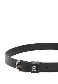 Black leather belt with a smooth texture, silver metal buckle, and a logo detail in an embossed finish. Simple and sleek design.