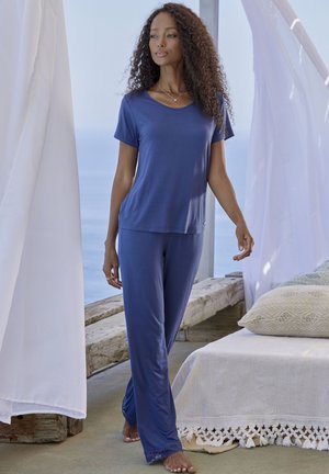 Navy blue, lightweight pajama set featuring a short-sleeve top with a rounded neckline and matching elastic-waist pants with lace accents.