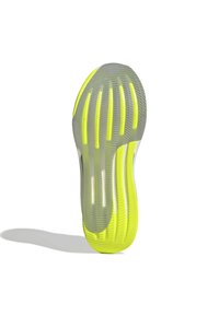 Shoe sole with a wavy design, featuring a translucent gray material and bright yellow accents. Textured surface with flexible grooves.