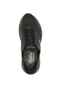 Black mesh sneaker with slip-on design, featuring textured upper, elastic laces, and branded insole. Ergonomic shape for comfort.