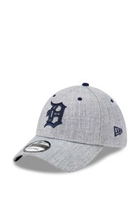 Gray baseball cap made of textured fabric with a navy embroidered "D" logo on the front and a curved brim. Adjustable strap on the back.