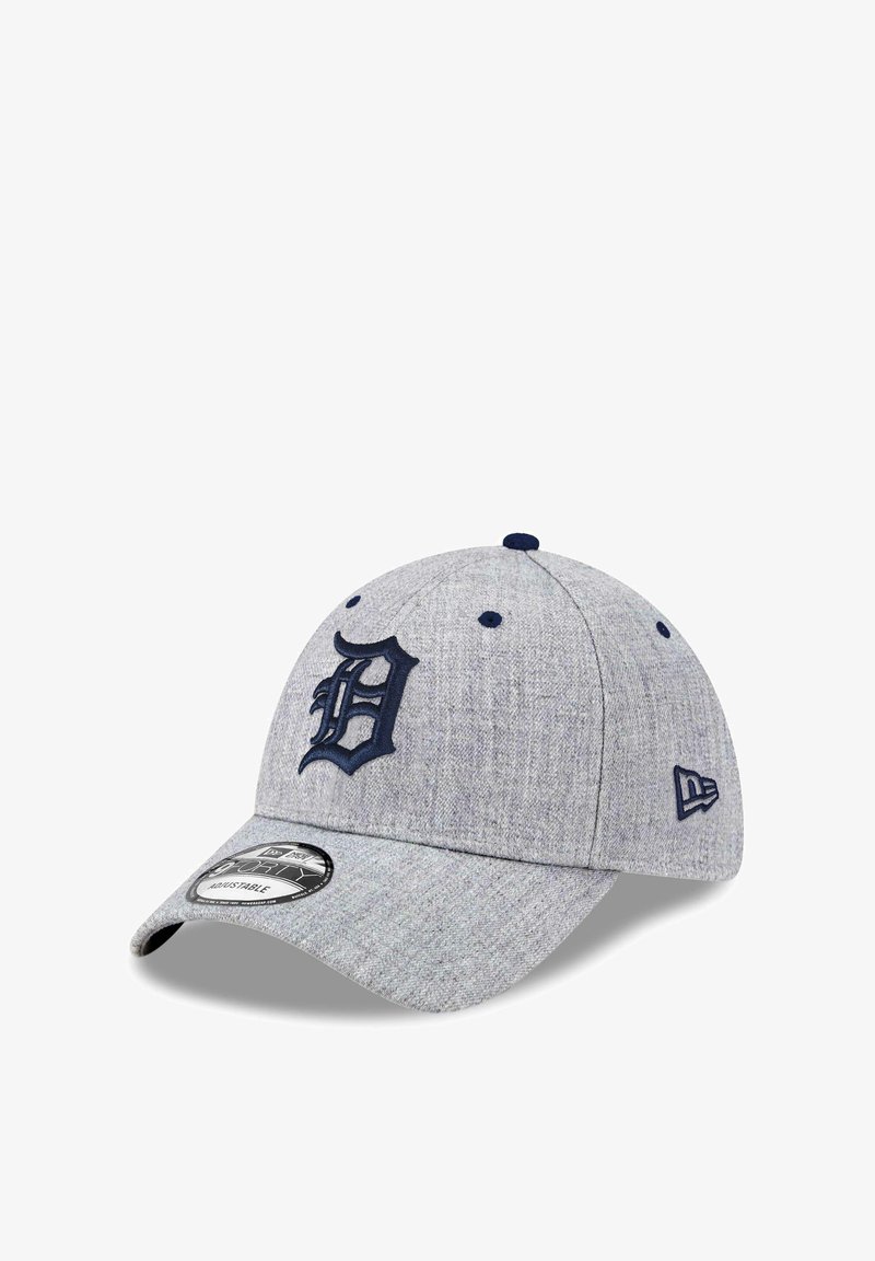 Gray baseball cap made of textured fabric with a navy embroidered "D" logo on the front and a curved brim. Adjustable strap on the back.