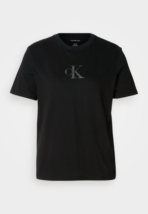Čierne bavlnené tričko s krátkym rukávom, ktoré na hrudníku obsahuje jemné šedé logo cK. Okrúhly výstrih a voľný strih so rovnými okrajmi.