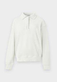Bluza albă cu guler din material texturat cu model canalat, cu fermoar până la sfert în față. Dispune de umeri lăsați și manșete strâmte.
