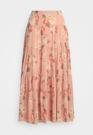 Gonna maxi floreale in morbido tessuto pesca, con strati a balze decorati da grandi fiori rosa e arancioni e foglie verdi. Design leggero e arioso.