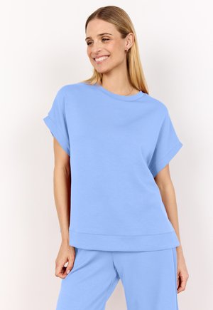 Top corto azzurro brillante con scollatura rotonda e vestibilità rilassata. Tessuto morbido e design a strati sull'orlo. Abbinato a pantaloni coordinati.