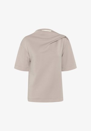 Light beige short-sleeve t-shirt featuring a relaxed fit, asymmetrical shoulder detail, and smooth, soft fabric texture.