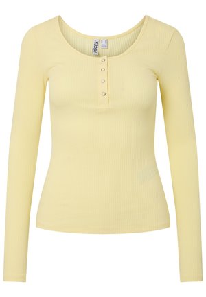 Ανοιχτό κίτρινο ριμπ μάλλινο πουκάμισο με μακριά μανίκια, στρογγυλή λαιμόκοψη και τέσσερα μικρά διακοσμητικά κουμπιά στην εμπρόσθια πατιλέτα.