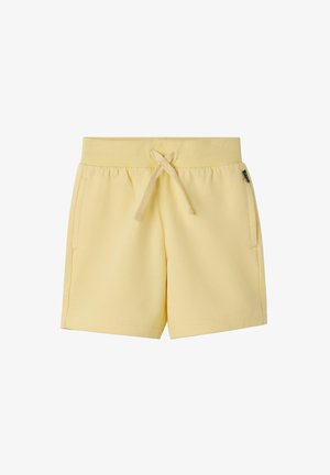 Lichtgele peuterbroekjes met geribbelde elastische tailleband en voorste trekkoord, voorzien van zijzakken en een klein zwart label aan de rechterkant.