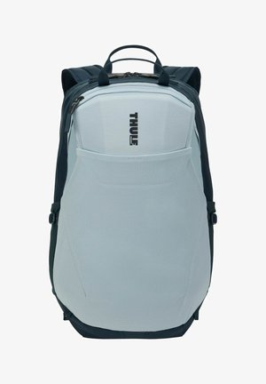 Sac à dos Thule gris clair et noir avec poche avant en mesh, poignée supérieure et bretelles rembourrées.