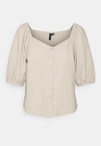 Beige blus med puffärmar, V-ringning och sex knappar framtill. Slät textur med avslappnad passform och subtil sömnadsdetaljering.