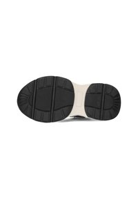 De zool van de schoen heeft een zwarte rubberen basis met textuurpatronen voor grip, versterkte gebieden voor duurzaamheid en een gladde crèmekleurige tussenzool.
