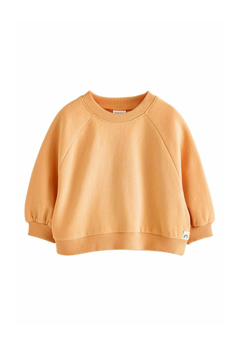 Felpa arancione con scollo rotondo, maniche raglan, orlo e polsini a costine, realizzata in tessuto morbido, con un piccolo logo nella parte inferiore.