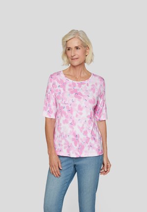 Light pink short-sleeve top with a loose fit featuring a floral pattern in darker pink and blue. Soft fabric with a crew neckline.