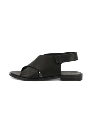 Sandalo piatto in pelle nera con cinturini incrociati sulla parte anteriore e cinturino regolabile alla caviglia, punta e tallone aperti, suola minimalista.