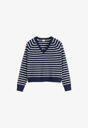 Sweter w pasy w kolorze granatowym i białym, z dekoltem w serek, długimi rękawami i ściągaczami. Wykonany z miękkiego dzianiny, z krótkim fasonem.
