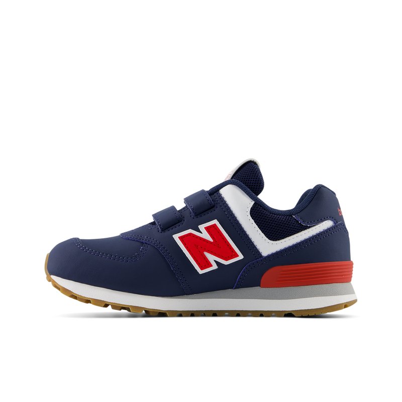 Marineblaue Sportschuhe mit roten Akzenten, weißen Mesh-Einsätzen und Klettverschlüssen. Mit einer strukturierten Gummisohle.