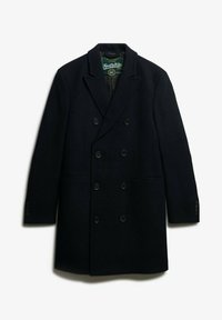 Manteau double boutonnage en laine bleu marine foncé avec un col cranté, deux poches latérales et six boutons, doublé d'un intérieur lisse.