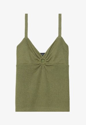 Oliivinvihreä neuletoppi ohuilla nauhoilla, jossa on kierrepintamuotoilu ja pyöreä korostus keskellä.