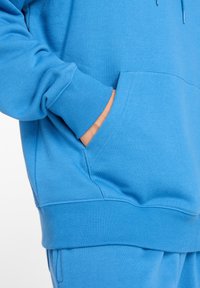 New Balance SPORT ESSENTIALS FRENCH TERRY - Hoodie - blue light blue