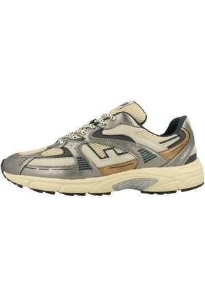 Beige and metallic gray athletic sneaker with mesh panels, patterned laces, and a cushioned cream sole.