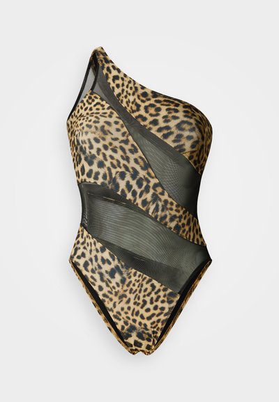Μαγιό ενός ώμου σε μπεζ χρώμα με σχέδιο λεοπάρ, διαθέτει διαφανείς μαύρες διχτυωτές λεπτομέρειες και εφαρμοστή σιλουέτα.
