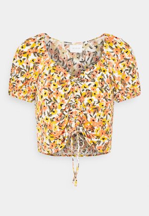 Korte mouwen, cropped top met een bloemenpatroon in oranje, geel en groen op een witte achtergrond; voorzien van een trekkoorddetail aan de voorkant.