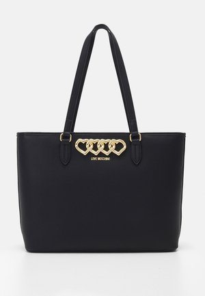 Musta nahkainen olkalaukku, jossa on kaksinkertaiset kahvat. Koristeena kultainen sydänketju ja logo. Sileä pinta ja jäsennelty muotoilu.