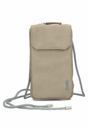 Beige Leder-Umhängetasche mit Klappverschluss und verstellbarem schwarz-weißem Kordelriemen, kleines "lamz"-Logo nahe dem unteren Rand gedruckt.