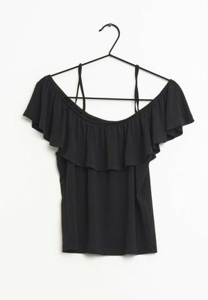 Black off-the-shoulder top with ruffled accents, thin straps, and a soft texture. Designed to fit snugly at the waist.