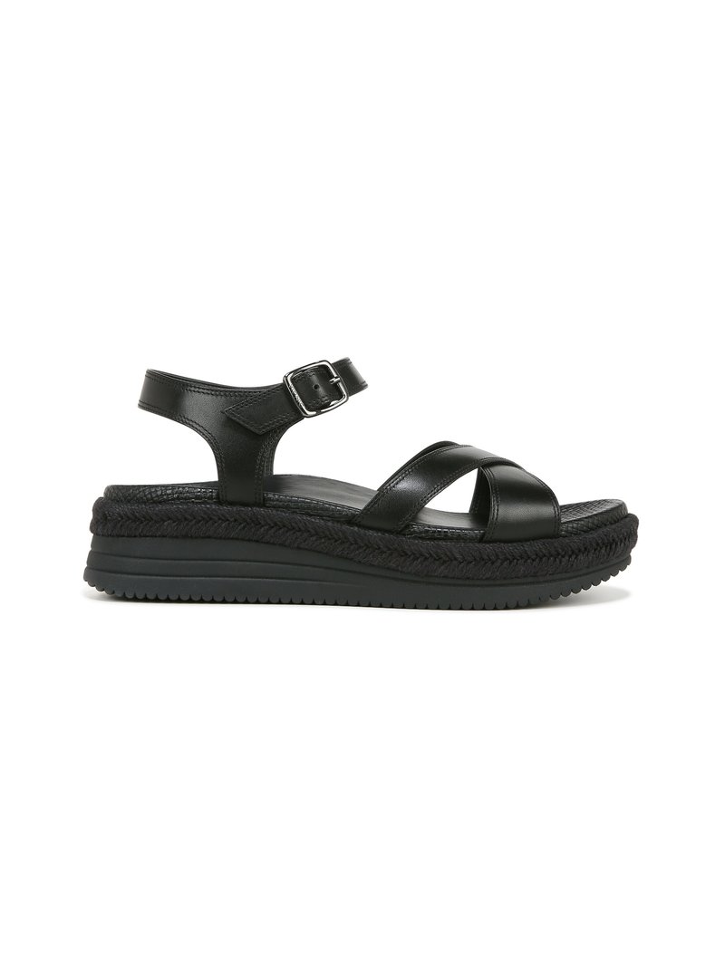 Black leather sandal with a braided sole, adjustable ankle strap, and wide crossing straps for comfort. Flat rubber outsole for traction.