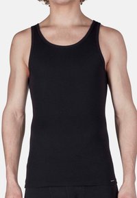 Top nero senza maniche realizzato in morbido cotone misto, con un taglio classico, spalline larghe e un design liscio e senza decorazioni.