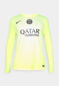 Maillot de football à manches longues de couleur jaune néon vif avec un motif en vagues, présentant le logo du Paris Saint-Germain et le texte QATAR AIRWAYS.
