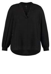 Zwarte blouse met lange mouwen, gemaakt van een gladde, lichte stof, met een V-halslijn en een licht afgeronde onderkant. Voorzien van gathered manchetten voor een relaxte pasvorm.