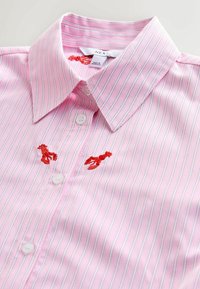 Pink striped shirt made of cotton, featuring white buttons and red embroidered lobsters on the chest. Collared design with a smooth texture.