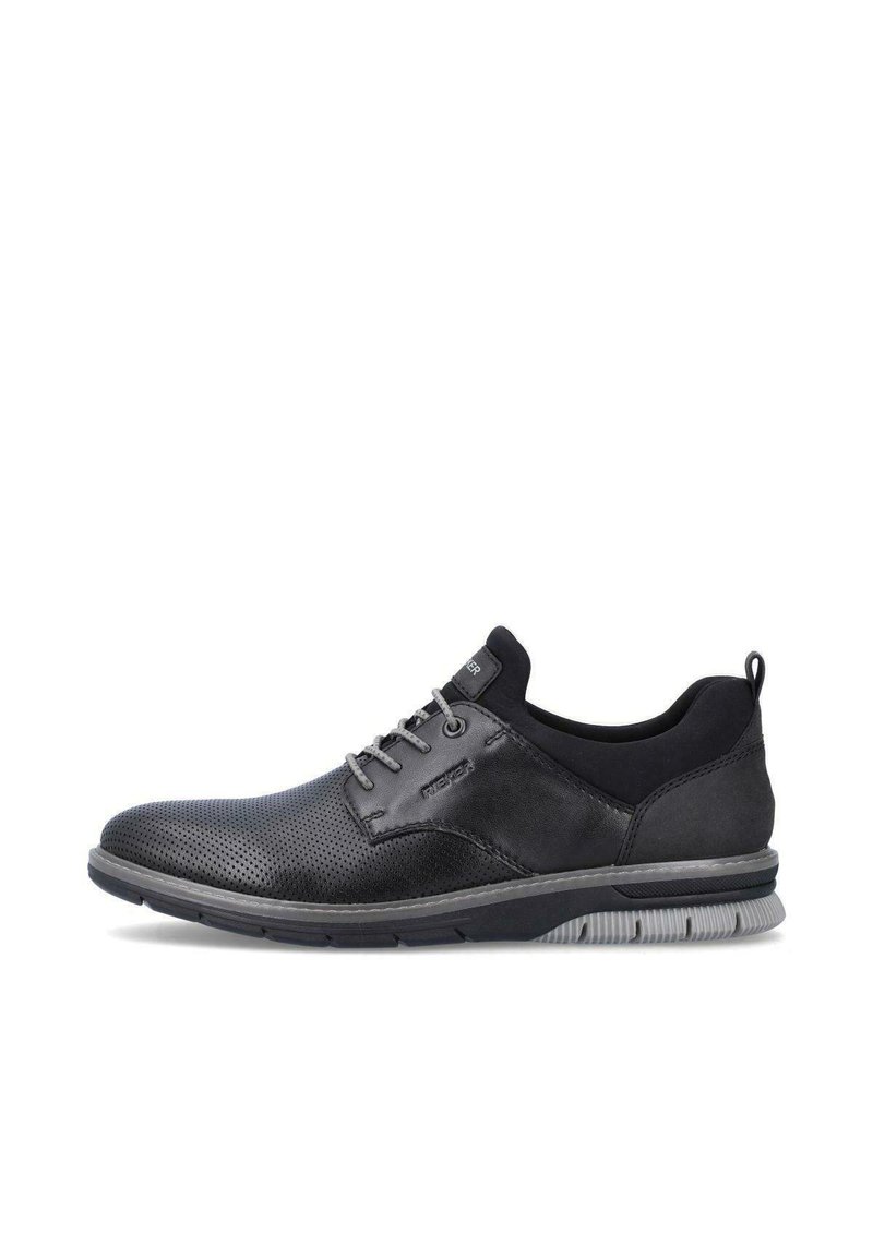 Black footwear featuring a combination of smooth and perforated leather. Rounded toe, lace-up design, and gray rubber sole.