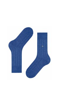 Chaussettes bleues à côtes avec une texture lisse et un talon renforcé. Présente un petit logo sur la cheville.