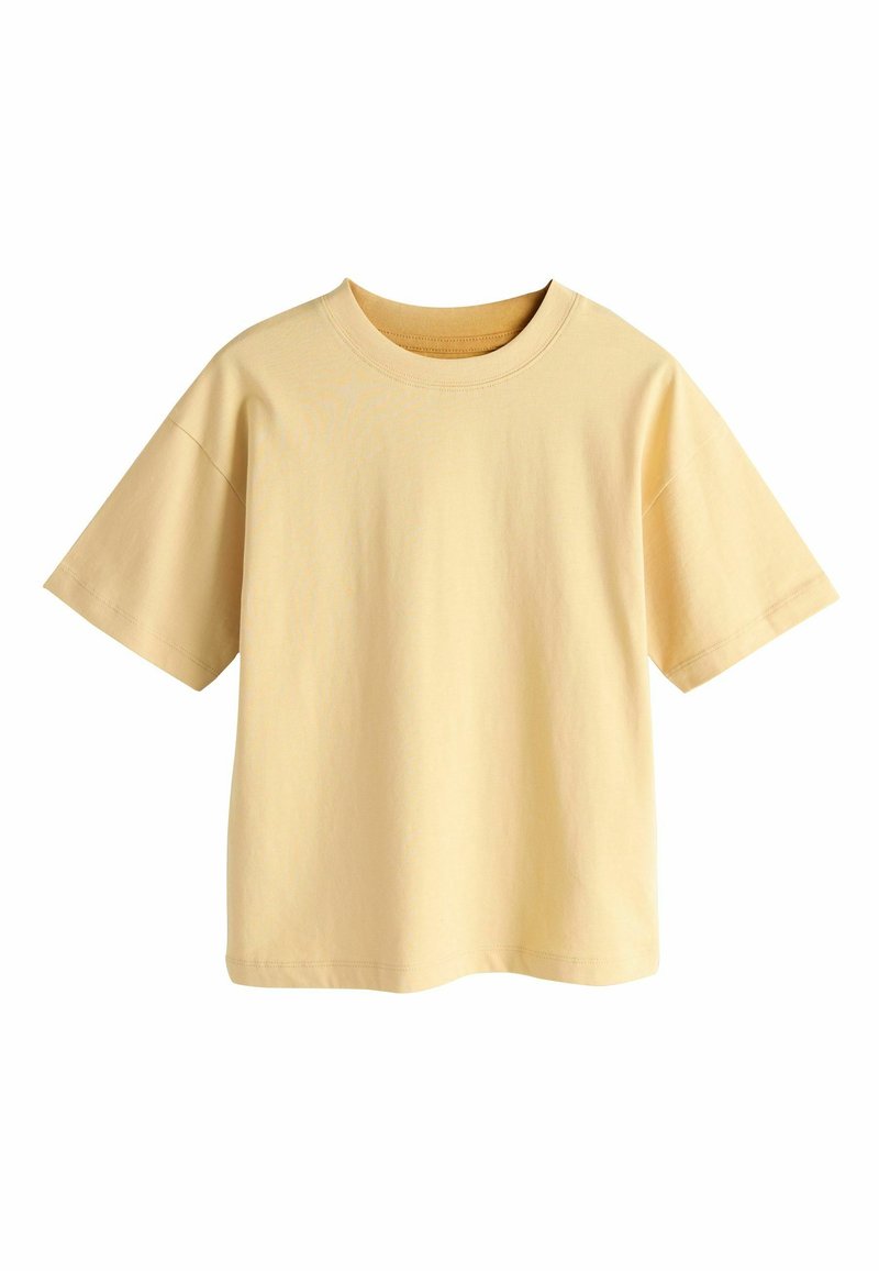 T-shirt à manches courtes en coton doux jaune pâle. Col rond avec une coupe décontractée et un ourlet droit. Aucun motif ou accent visible.