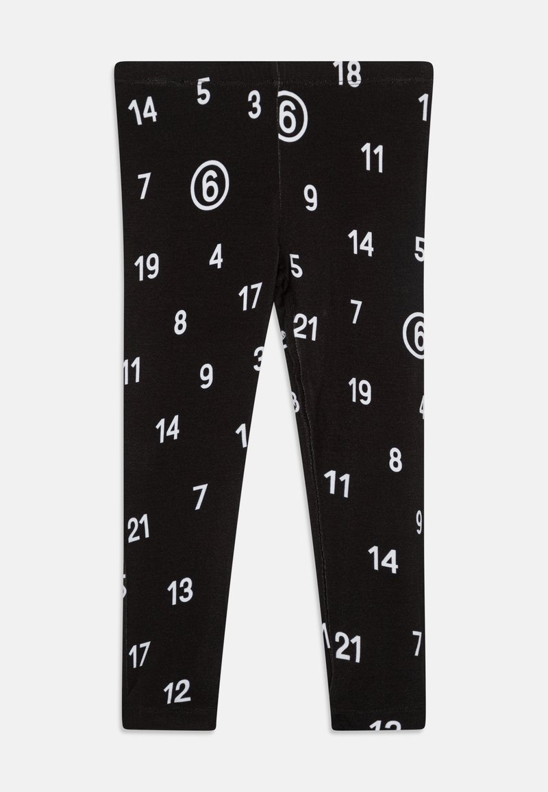 Black leggings featuring an all-over white number print, including circles, in various sizes. Soft material with a fitted design.