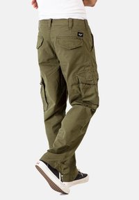 Khaki-Cargo-Hosen mit mehreren Taschen, verstellbaren Bündchen und lockerer Passform. Hergestellt aus strapazierfähigem Baumwollstoff mit strukturierter Oberfläche.