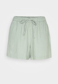 Shorts en lin vert clair avec une taille élastique et un cordon à nouer à l'avant. Présentent une coupe décontractée et un ourlet simple.