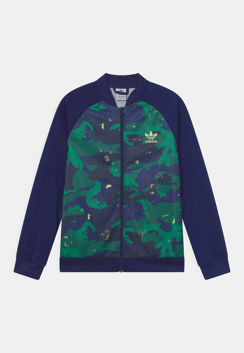 Marinblå och grön kamouflagemönstrad zip-jacka med gyllene detaljer, med ribbade ärmslut och en enfärgad baksida, tillverkad av ett mjukt och lätt tyg.